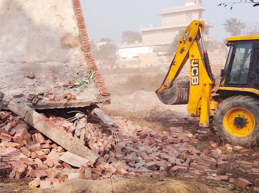 JCB collapsing illegal construction in illegal colony being built in Roshanpur.