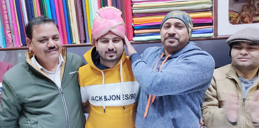 Member wearing a turban to Yasin Khan, who became the head of the new executive committee of the Gannaur Samaj Seva Samiti.