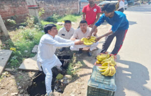 District councilor protested and demanded safe roads by filling potholes.