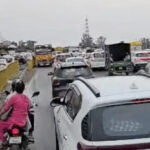 Youth climbs 250-foot-high electricity tower in Sonipat; highway jammed, power supply cut off.