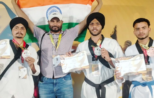 Sonipat: Medal winners returning from Thailand welcomed at Delhi Airport.